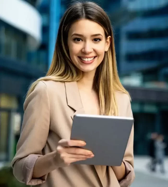 successful-businesswoman-using-a-digital-tablet-while-standing-in-front-of-business-building-ppdrzjbzazpnaj8j795nna94r2gpgbz53u4u2op0r4